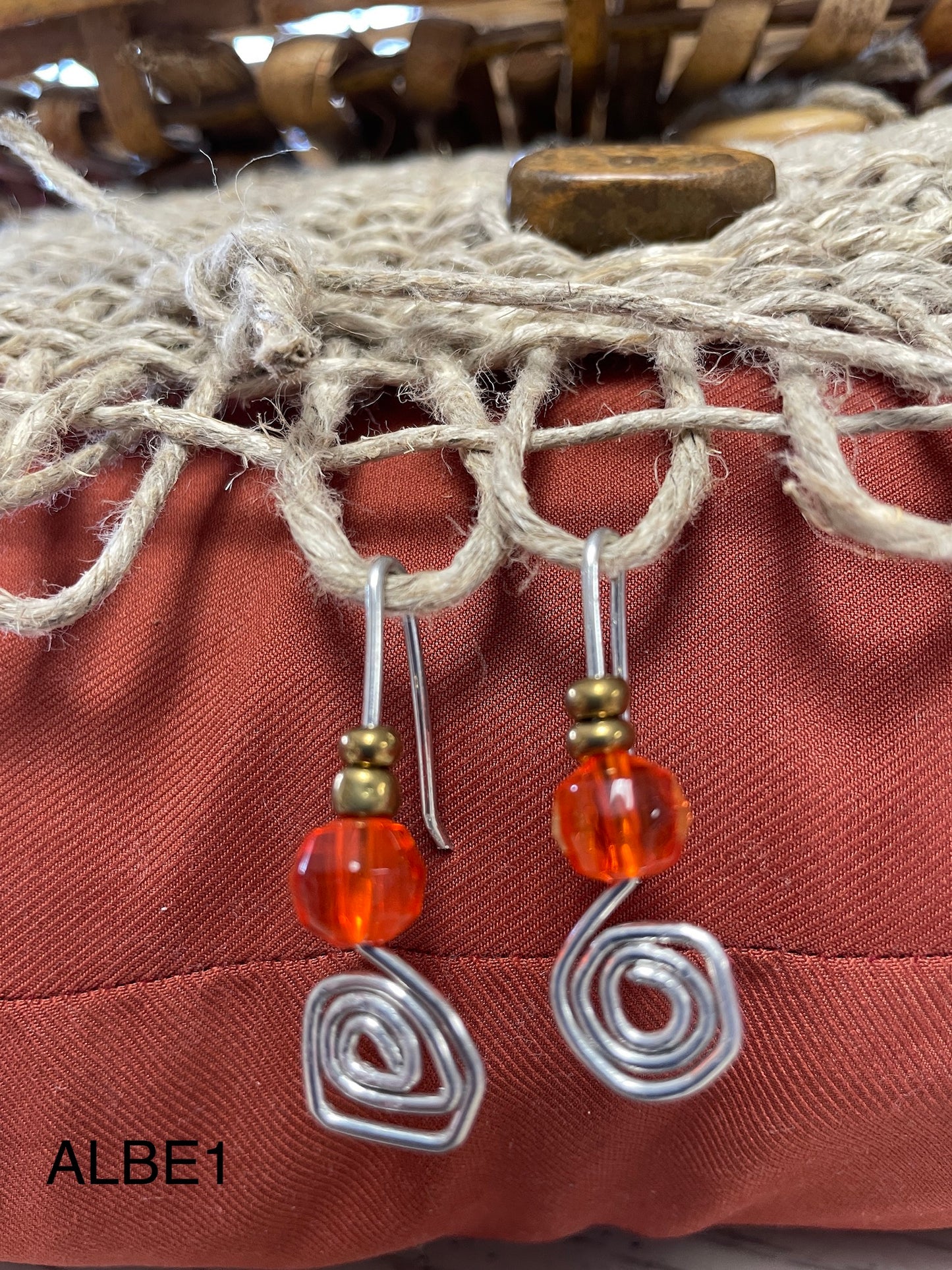 Spiral with orange and metal beaded earring ALBE1